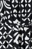 Mouwloos traveljurkje met print met ronde hals met plooitjes en all-over print in de kleur zwart/off white.