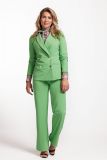 Travel broek met wijde pijp, elastieken trailleband en steekzakken van het merk Studio Anneloes in de kleur light green.