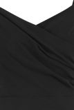 Getailleerde traveldress met spaghettibandjes en overslag van het merk Studio Anneloes in de kleur zwart.