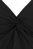 Singlet van travelstof van het merk Studio Anneloes met verstelbare smalle bandjes en een knoopdetail bij de borsten in de kleur zwart.