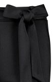 Bonded travelbroek met pintuck, aangesloten fit, steekzakken en bijpassend strikceintuur van het merk Studio Anneloes in de kleur zwart.