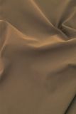 Flairbroek van travelstof met elastieken tailleband met riemlusjes van het merk Studio Anneloes in de kleur bruin.