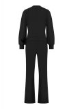 Jumpsuit van travel stof met overslag, V-hals, lange mouwen met boorden en steekzakken van het merk Studio Anneloes in de kleur zwart.