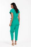 Jumpsuit van travel stof met kort mouwtje, 7/8 lengte en steekzakken van het merk Studio Anneloes in de kleur licht groen.