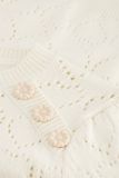 Gebreide pullover van het merk Fabienne Chapot met hartjes dessin, korte mouwen, ronde hals en knoopjes op de schouder in de kleur cream white.