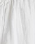 Korte luchtige jurk met verstelbare spaghettibandjes, ruches en strikkoord in de kleur wit.