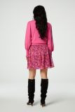 Roze hebreide trui met pofmouwen van het merk Fabienne Chapot.