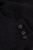 Gebreide trui met opgengewerkte hartjes in de kleur zwart.