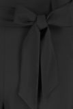 Travel jumpsuit van het merk Studio Anneloes met lange mouwen, wijde pijpen, een knoopsluiting en een strikceintuur in de kleur zwart.