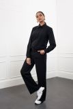 Travelbroek van het merk Studio Anneloes met wijde pijpen, elastieken tailleband, steekzakken voor en faux paspelzakken aan de achterkant in de kleur zwart.
