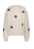 Sweater van het merk Fabienne Chapot met ronde hals, lange mouwen, geribde boorden en all-over geborduurde zonnetjes in de kleur off white.